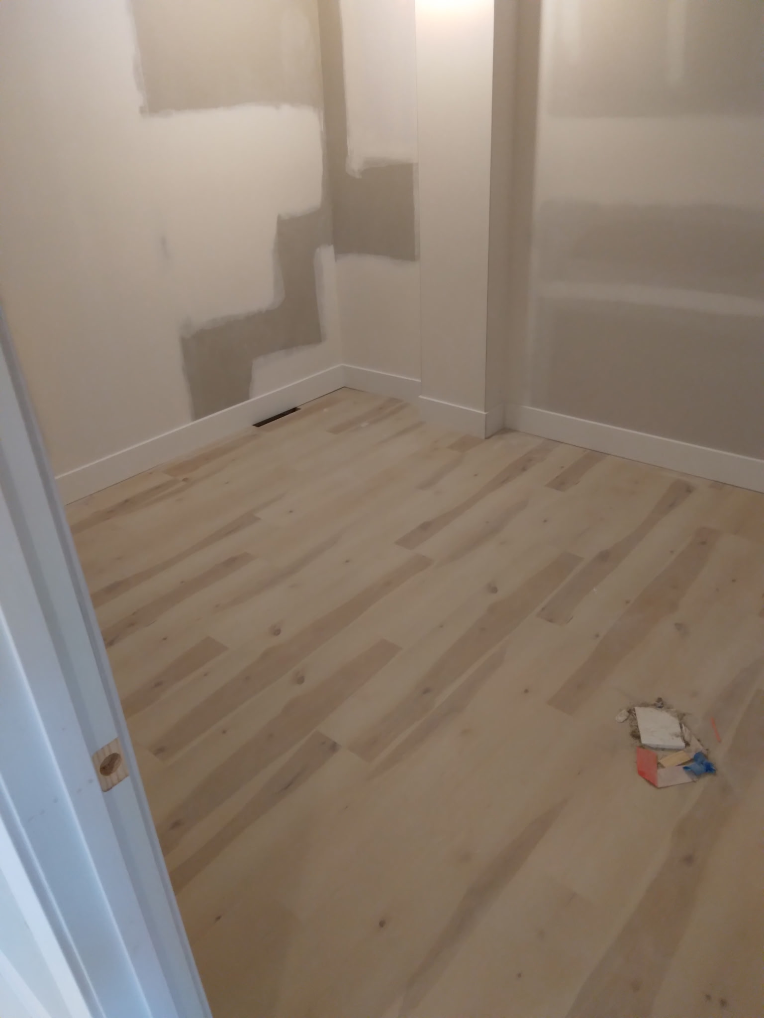 Light wood flooring with painted walls