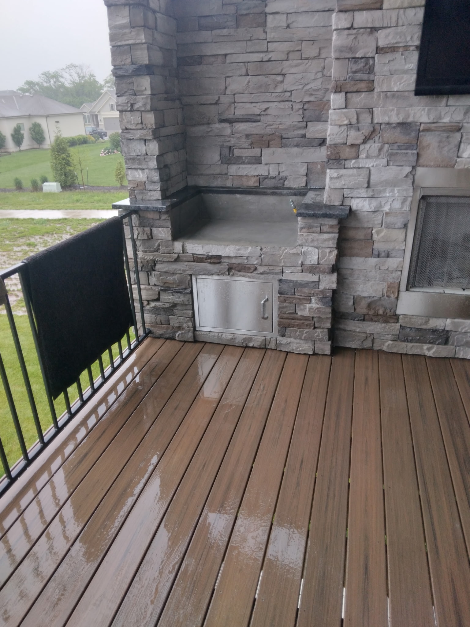Composite deck with outdoor kitchen