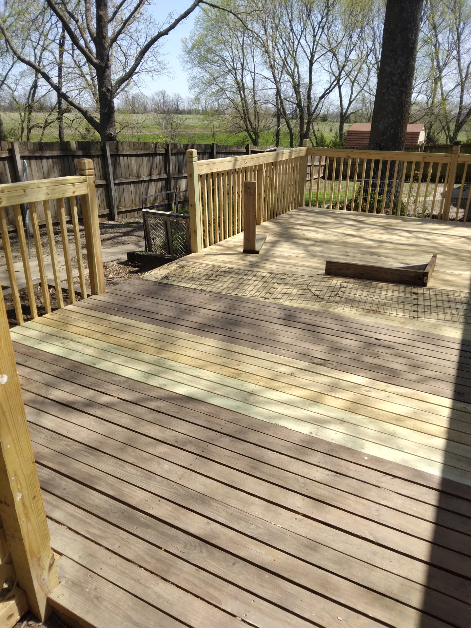 Large deck with fence railing